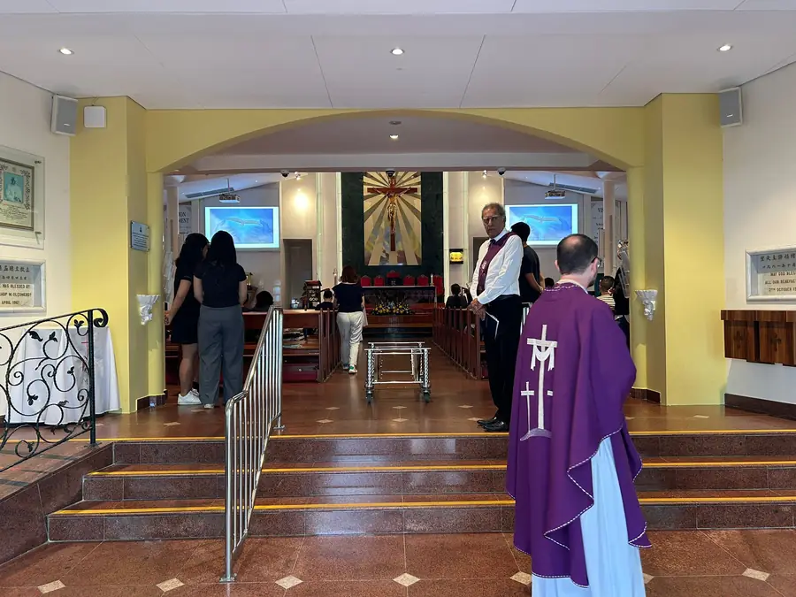 Priest leading christian funeral service