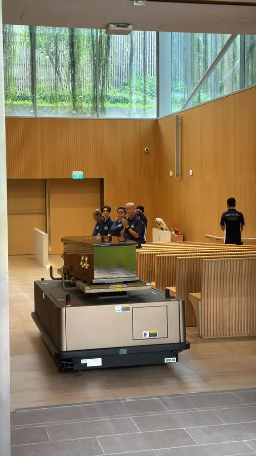 Coffin entering mandai crematorium hall