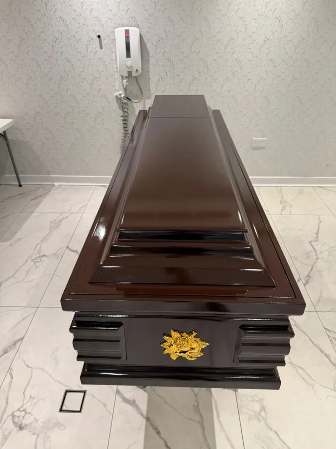 Sealed hardwood coffin ready for overseas shipping