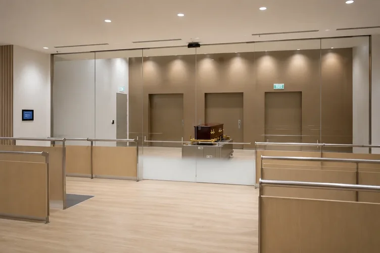 An intimate small farewell gathering inside a minimal modern chapel