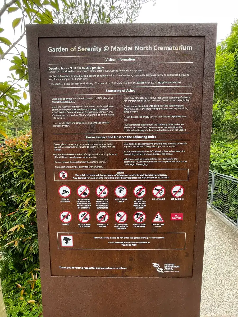Official NEA notice board at Garden of Serenity listing visitor information and garden rules